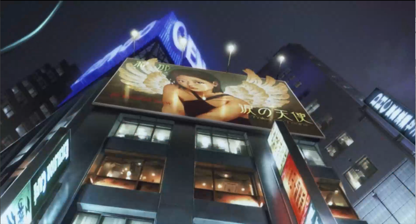 Night illuminated billboard of a woman with wings.