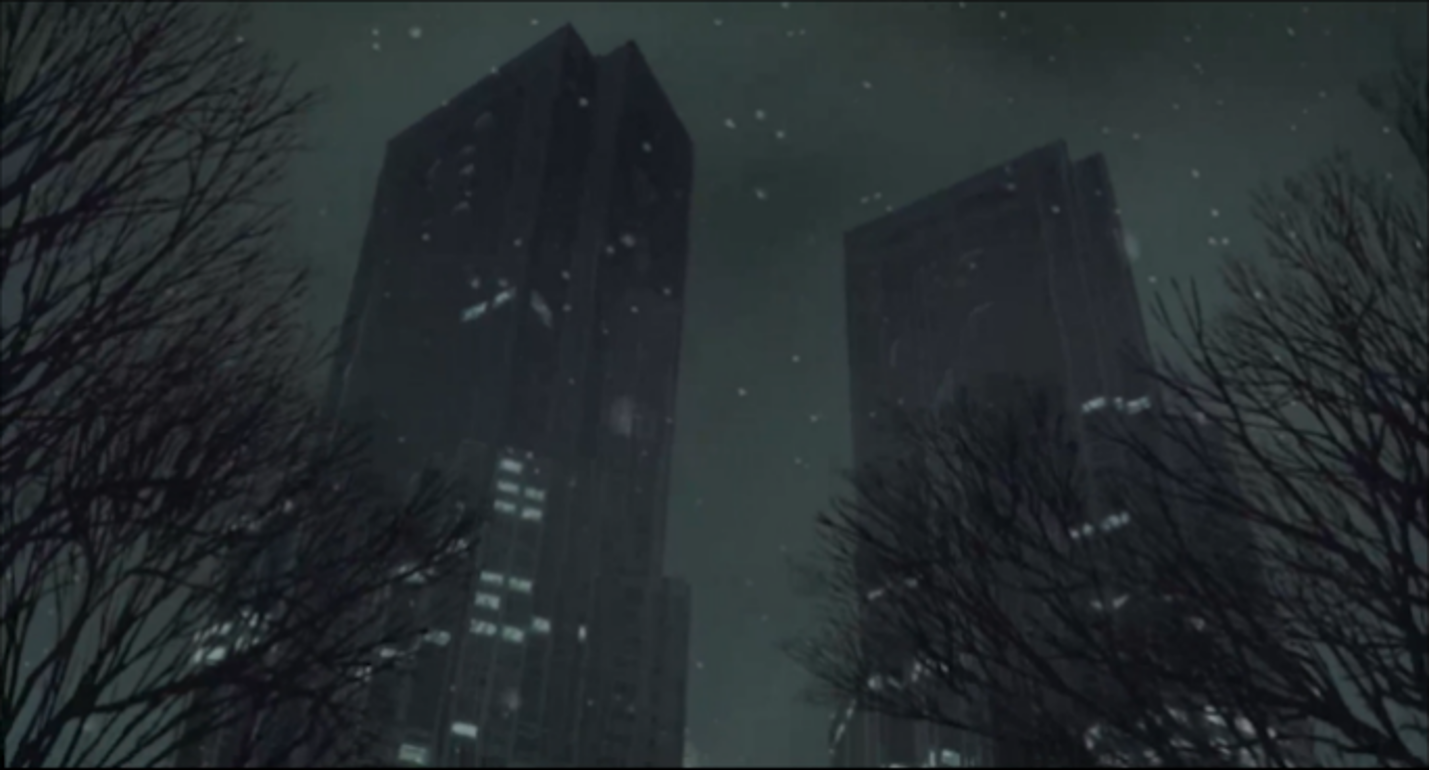 City skycrapers (two) at night, seen from below.