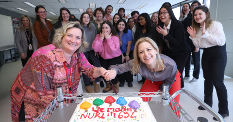 Professors Susan Drouin and Christine Maheu cut the specially baked cake congratulating students on the successful completion of their final year projects