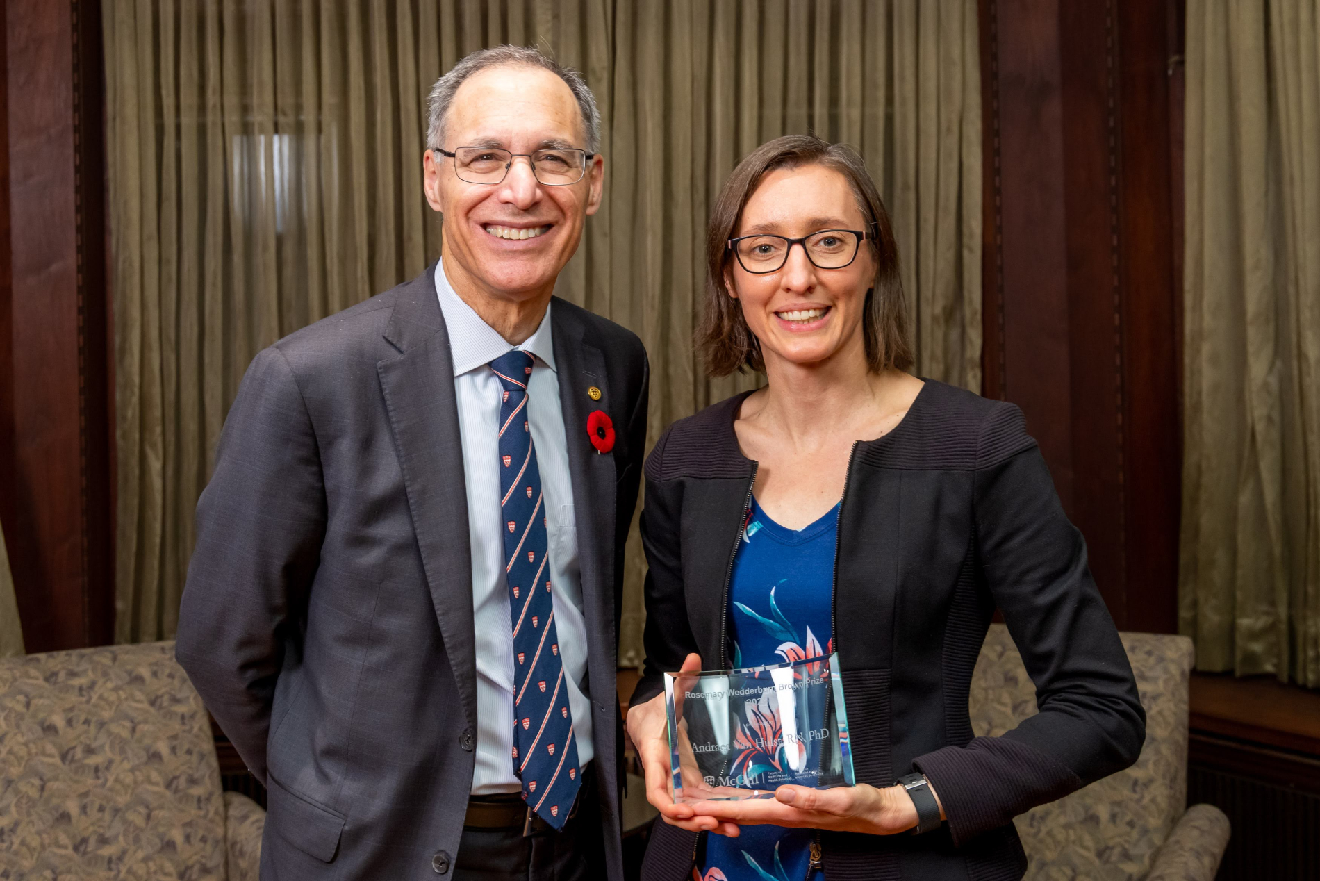 Dean David Eidelman congratulates award winner Professor Andraea Van Hulst