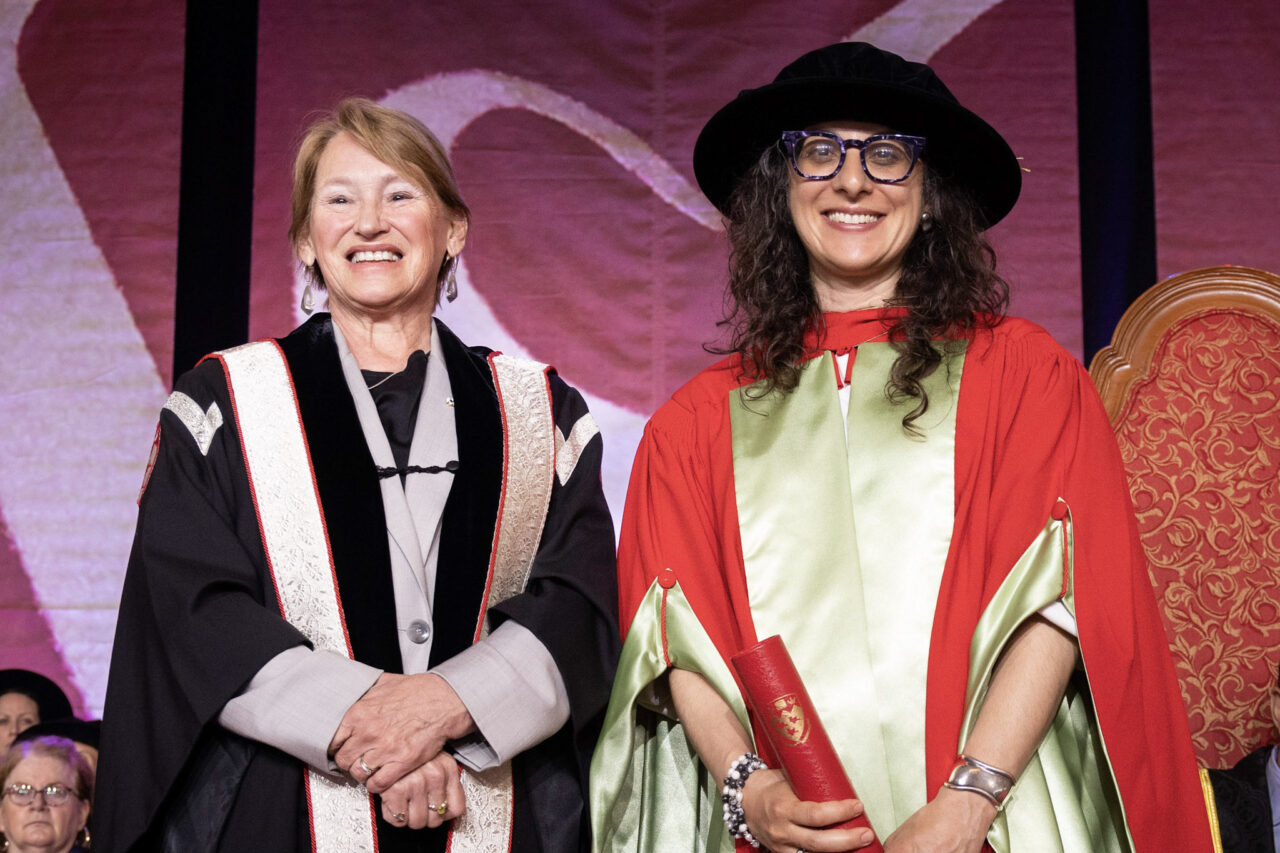 Principal Suzanne Fortier presents teaching award to Argerie Tsimicalis