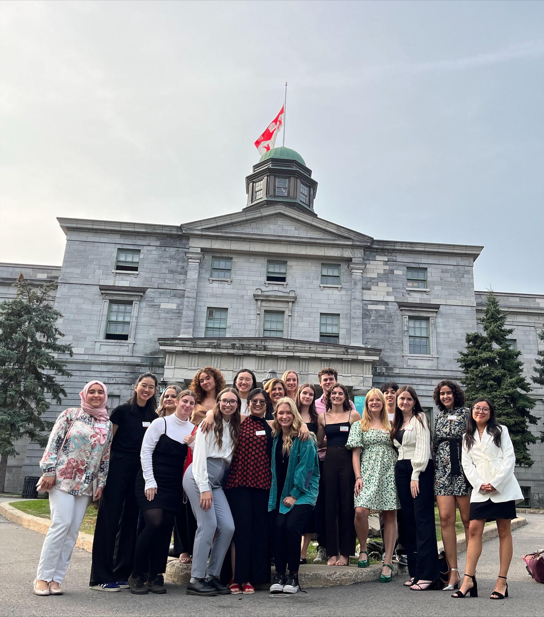A group of first year students pose outside the McGill Arts Building following the Nursing Professionalism Ceremony on September 28, 2023.