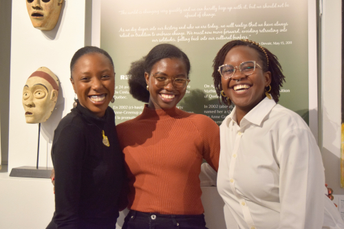 Three members of the Black community enjoying the evening at the Museum