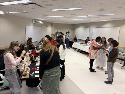 Guest browse and shop at the Indigenous market featuring crafts by Indigenous artists.