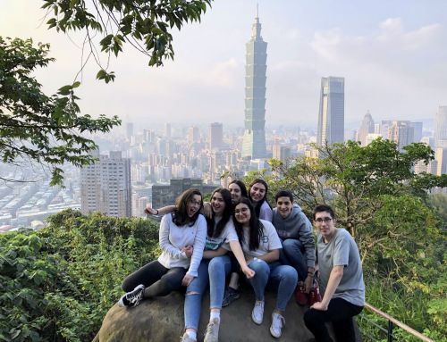 Kyla Christianson poses outdoors with 5 other teenagers in Taiwan