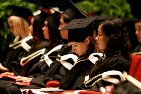 students with their graduation garments