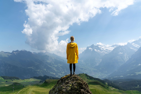 Woman on top of a mountain