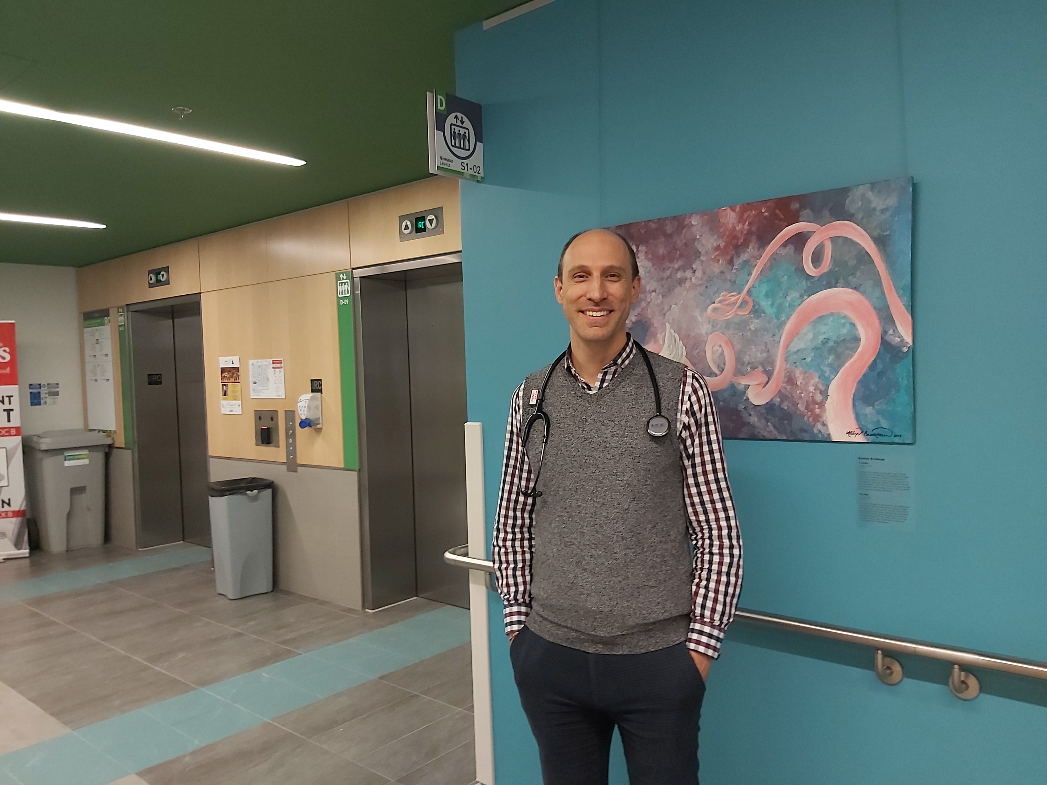 Medical oncologist, Dr. Scott Owen, in hospital corridor