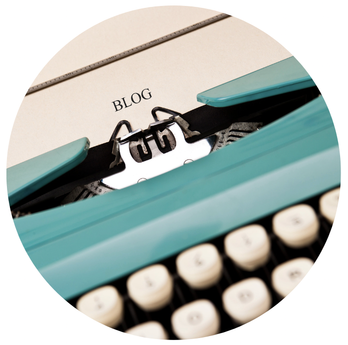 Blue typewriter with the word "blog" written on paper