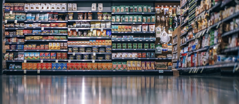 Aisle of refrigerated, mostly processed foods.