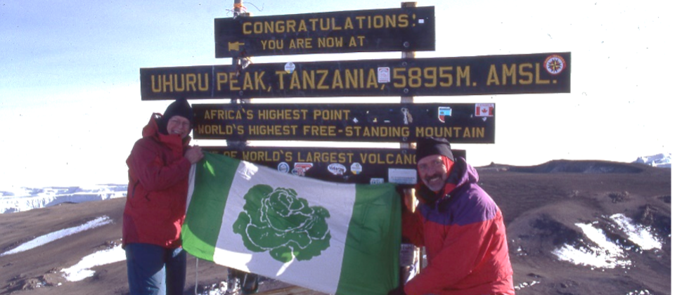 Patricia Brubaker and Stephen Poulin fly the flag of Cabbagetown, Toronto, at the summit of Mt. Kilimanjaro.