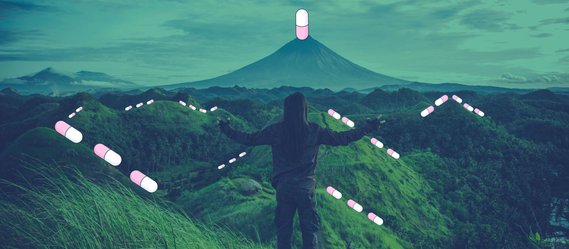 Silhouette of a person facing a mountain.