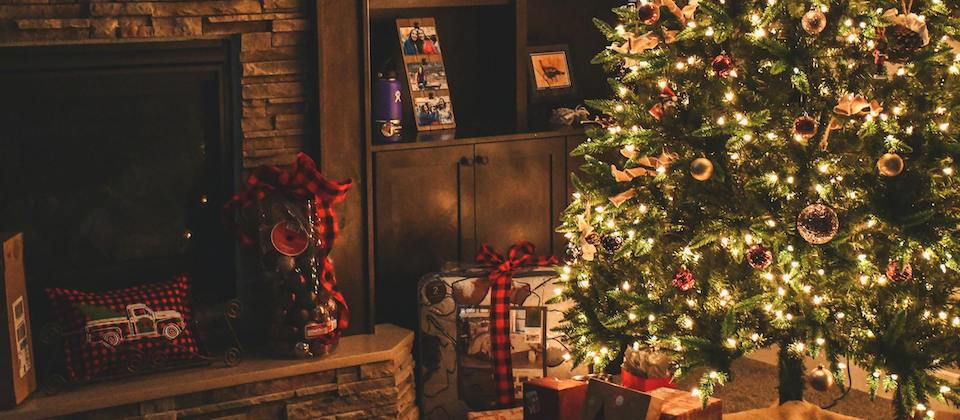 christmas tree and chimney surrounded by gifts