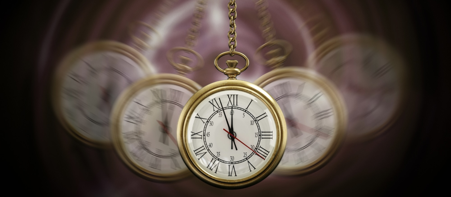a gold pocket watch swings on a chain, creating a blurred motion effect 