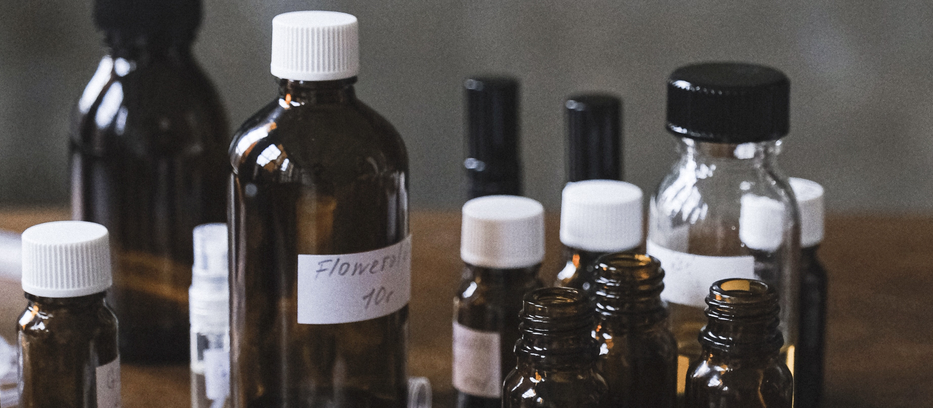 Collection of essential oils in various sized bottles.