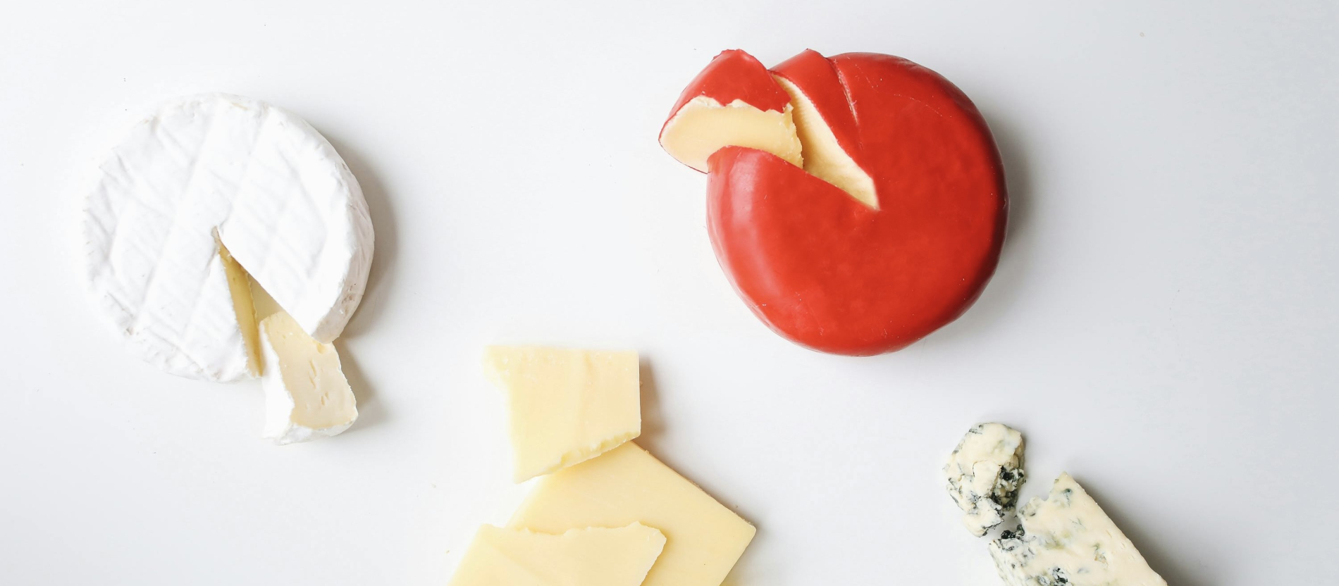 Brie, blue cheese, and cheddar cheese assortment.