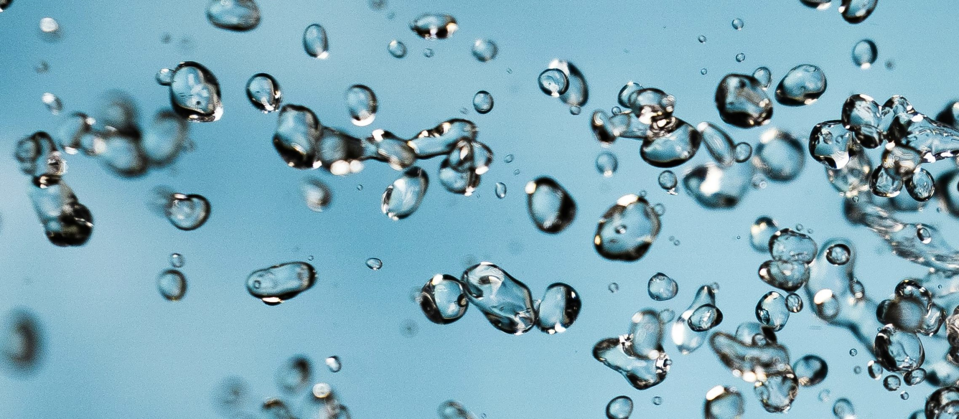 Blue bubbles suspended in liquid.