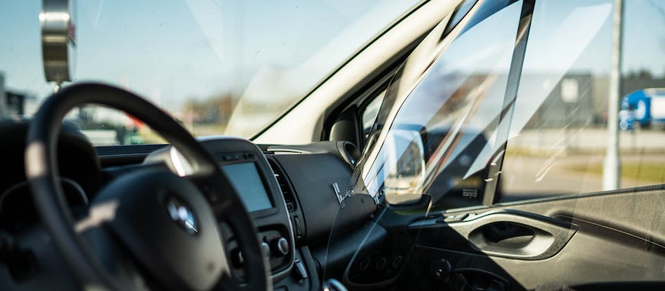 sheet of plexiglass inside of a car