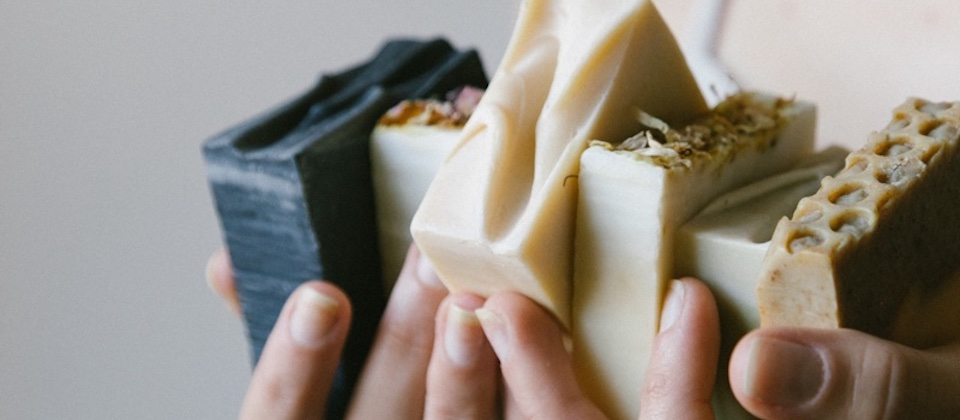 A person Holding artisanal Bar Soaps