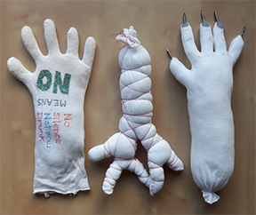 three stuffed cloth hands