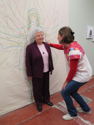 Maria drawing the outline of P. Smith
