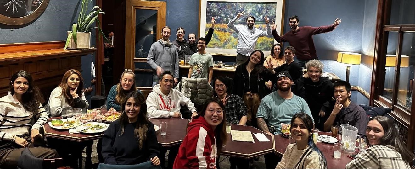 students from the Alan Edwards centre for research on Pain at a dec 13 2023 holiday event at Thompson house