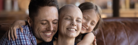 Husband and child hugging wife mother fighting against cancer