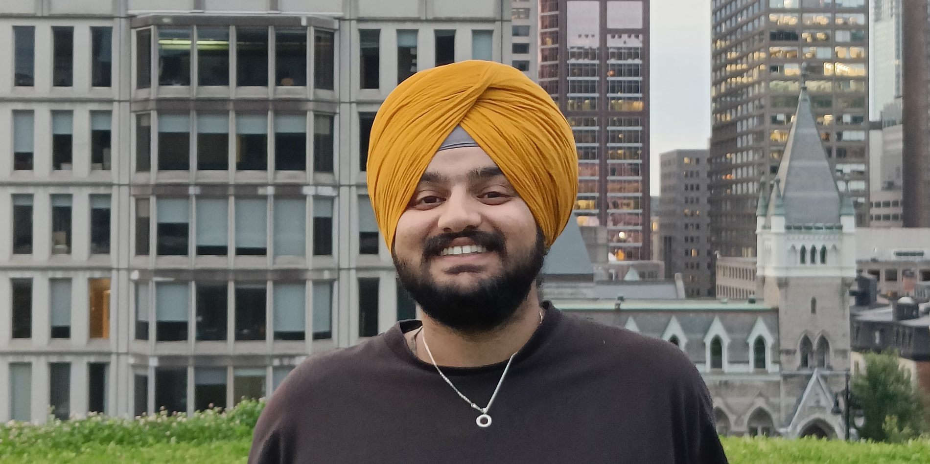 Prabhjot Singh Sanghera with the Montreal skyline in background