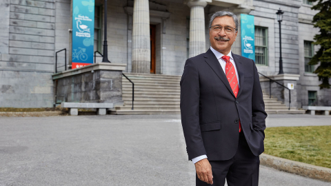 President Deep Saini standing in front of the Arts Building on McGill's downtown campus
