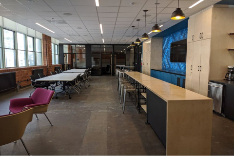 engine space at Adams building, table and chairs and a bar 