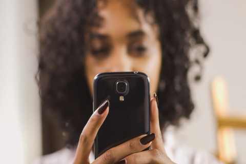 lady holding a phone