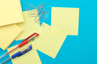 post it notes, pens and paperclips