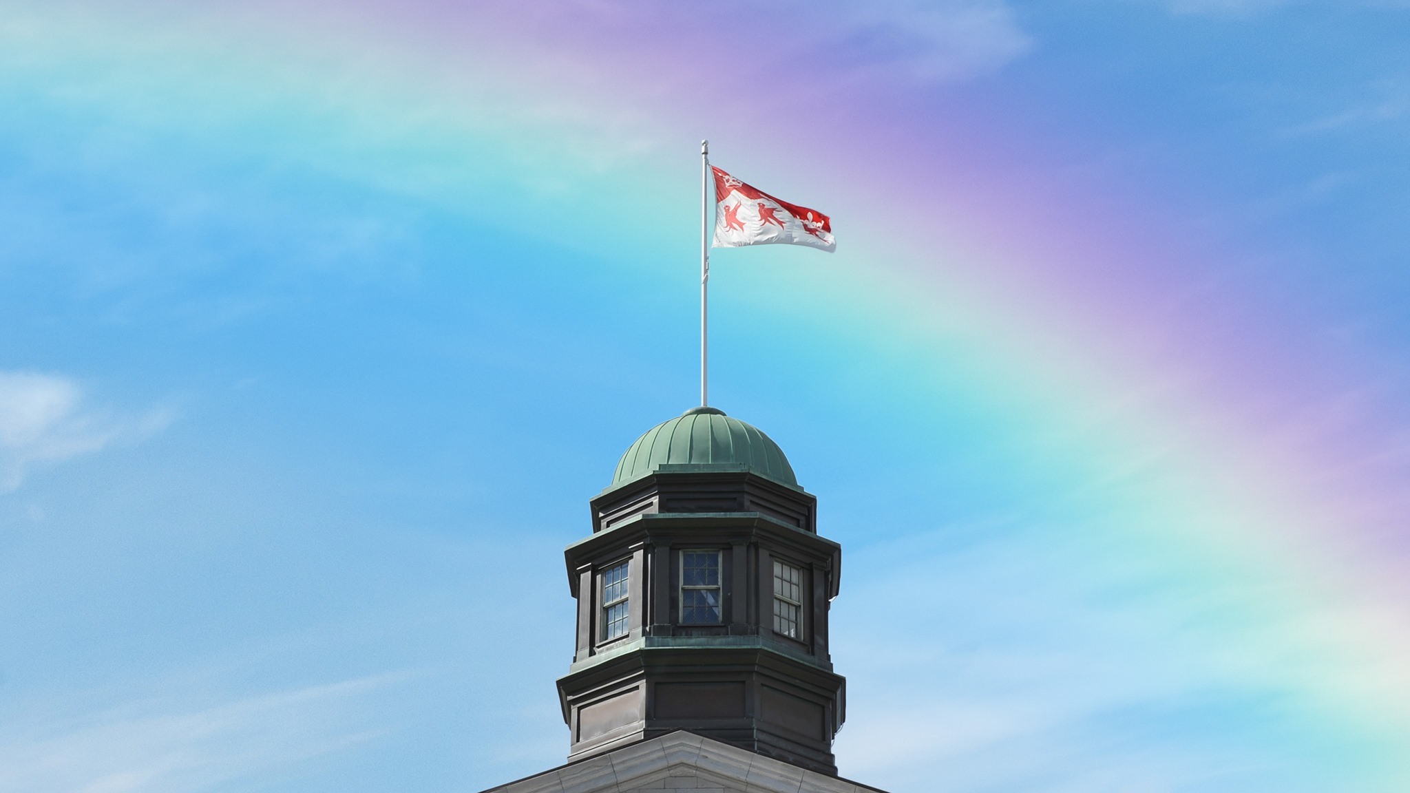 The McGill Arts Building with a rainbow