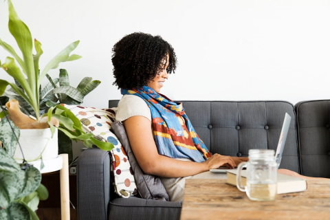 Woman works on computer at home