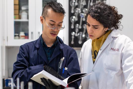 researchers looking into a book