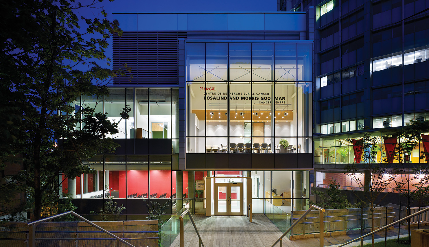 The Rosalind and Morris Goodman Cancer Institute Building entrance at night