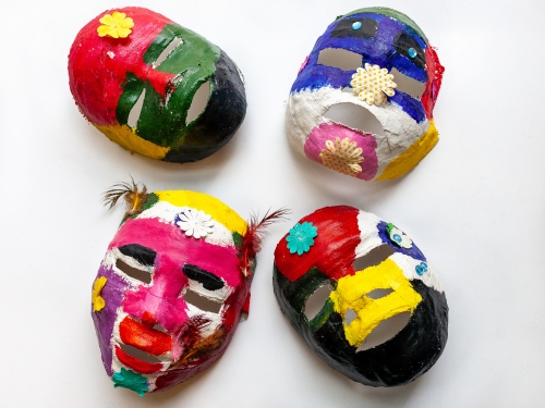 Plaster masks of children's faces, in multi-colour. Photo by Karene-Isabelle Jean-Baptiste.