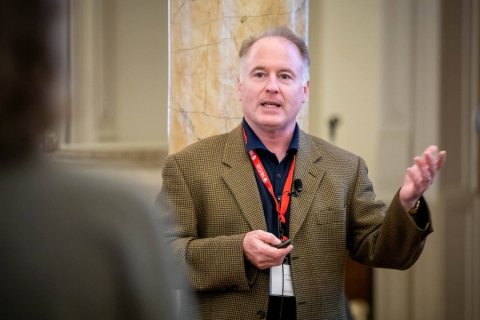 Mark Weber speaking at a conference.