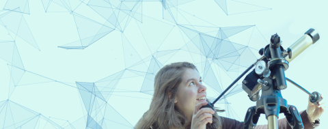 a student looking through a telescope at the sky