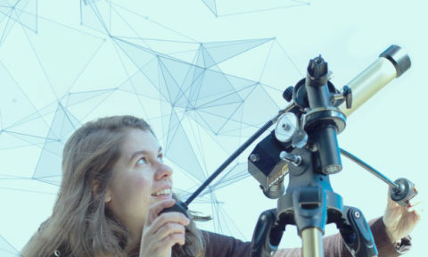 a student looking through a telescope at the sky