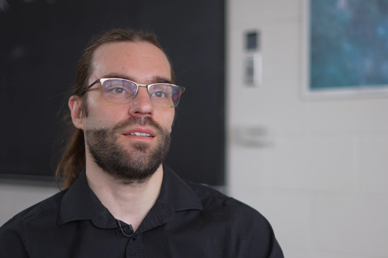 Simon Caron-Huot looking off camera 