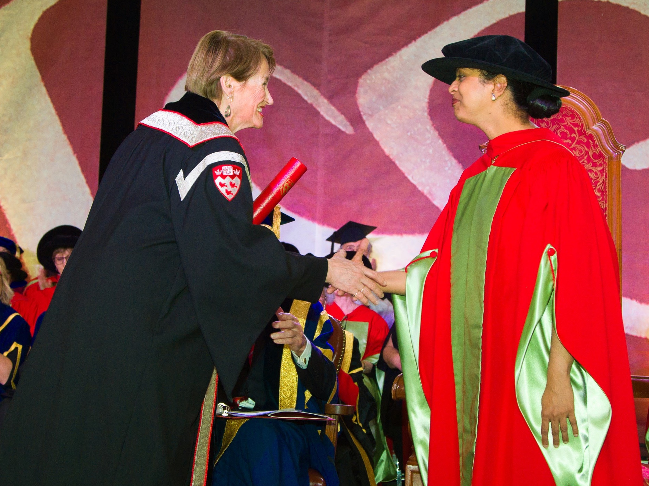 McGill Principal Suzanne Fortier shaking hands with an award winner at convocation