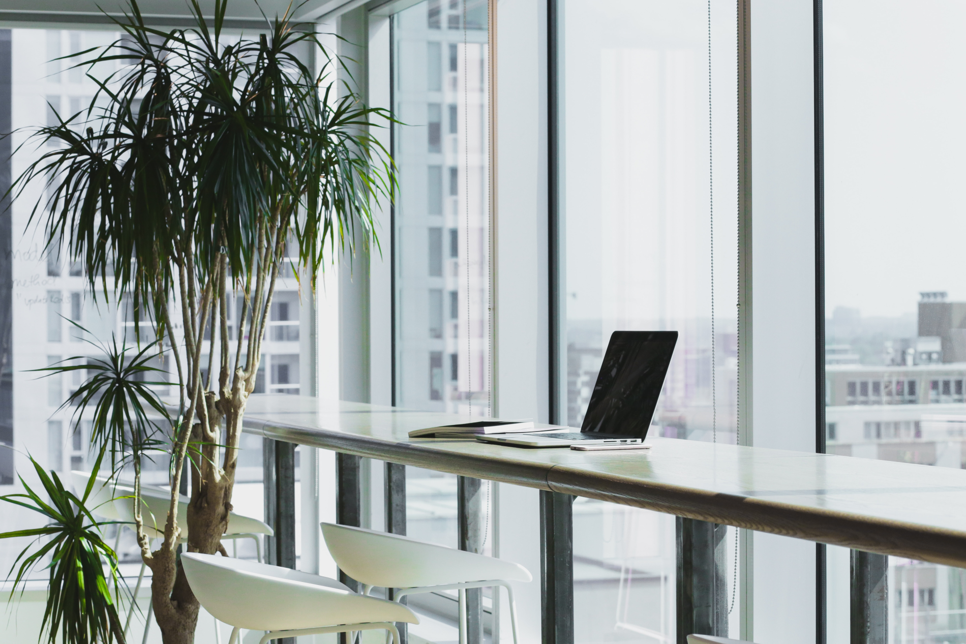 Unattended laptop in a bright office space