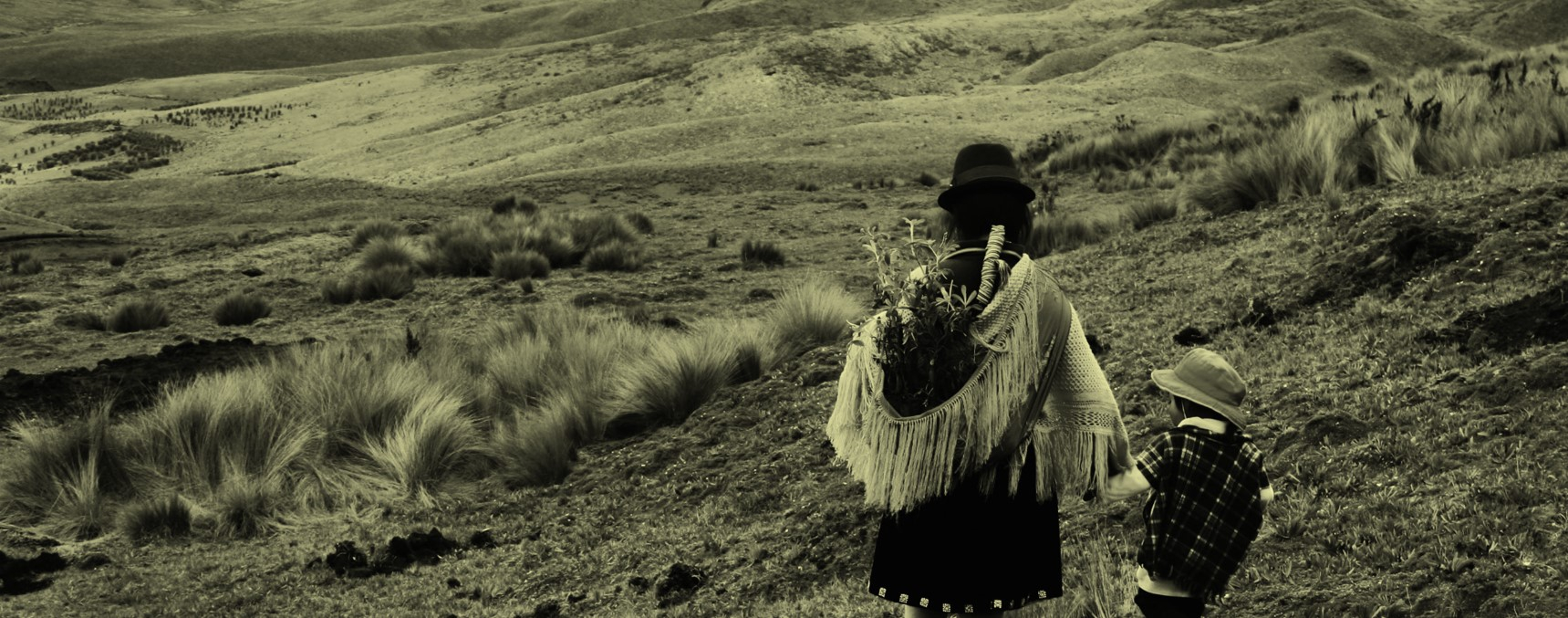 Mother and son walking in a valley. 
