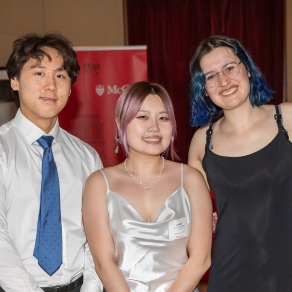 Happy smiles of the faces of three Lavendar Grad celebrants.