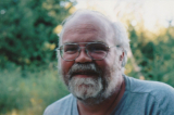 Dr. Watkins with trees in background