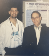 Dr Rosenblatt and former lab member in front of poster, late 90s or early 2000s