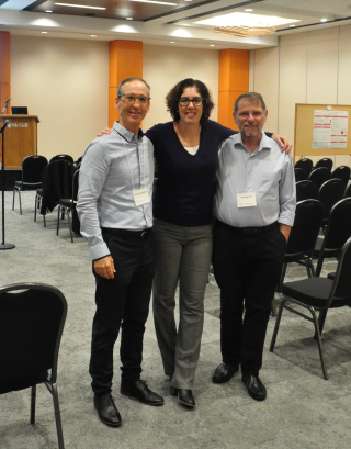 Three professors at symposium