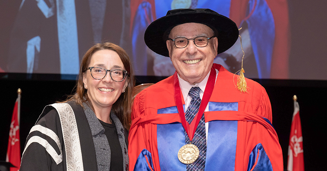 Dr. Phil Gold poses for a photo with Angela Campbell, co-Acting Provost and Assistant Provost