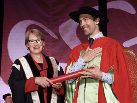 Gabriel Venne receives the Leo Yaffe Award from Ex-Principal Fortier at the 2022 Spring Convocation Ceremony
